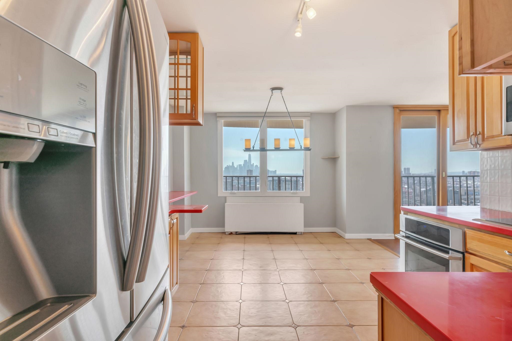 380 Mountain Road, Unit 213 Union City, NJ 07087 - Photo 12 of 36 a living room with stainless steel appliances furniture and a window
