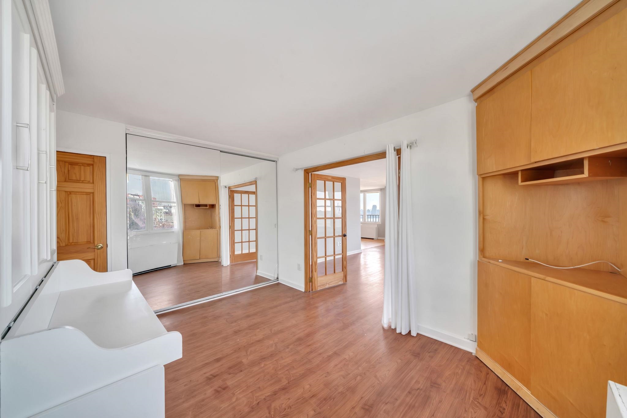 380 Mountain Road, Unit 213 Union City, NJ 07087 - Photo 20 of 36 wooden floor in an empty room