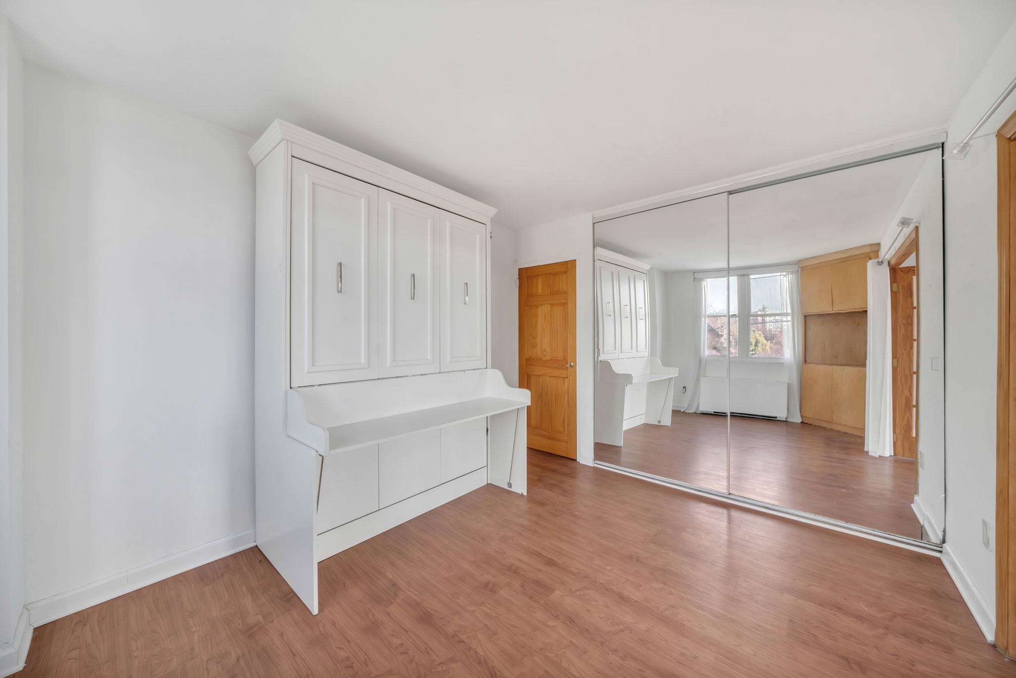 380 Mountain Road, Unit 213 Union City, NJ 07087 - Photo 21 of 36 wooden floor in an empty room with a window