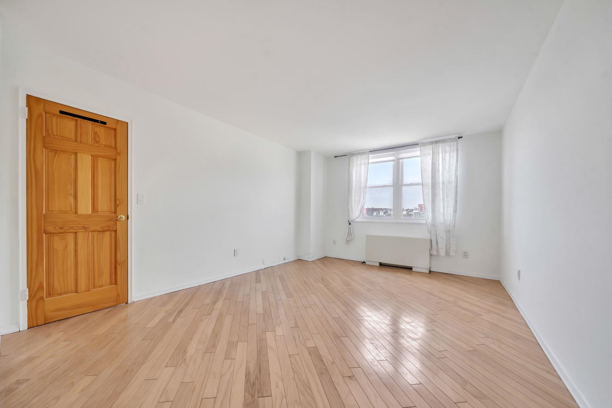 380 Mountain Road, Unit 213 Union City, NJ 07087 - Photo 24 of 36 a view of an empty room and a window