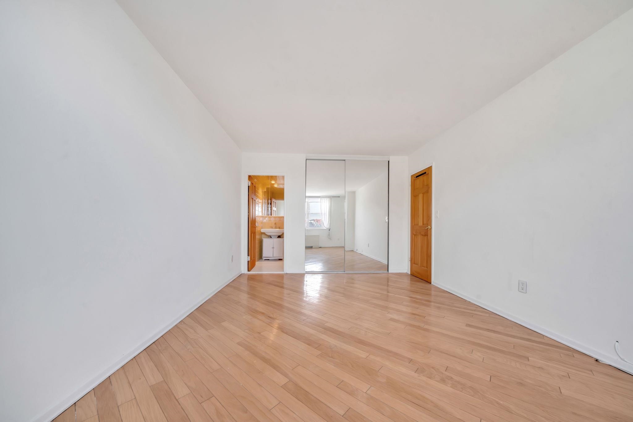 380 Mountain Road, Unit 213 Union City, NJ 07087 - Photo 26 of 36 a view of empty room with wooden floor
