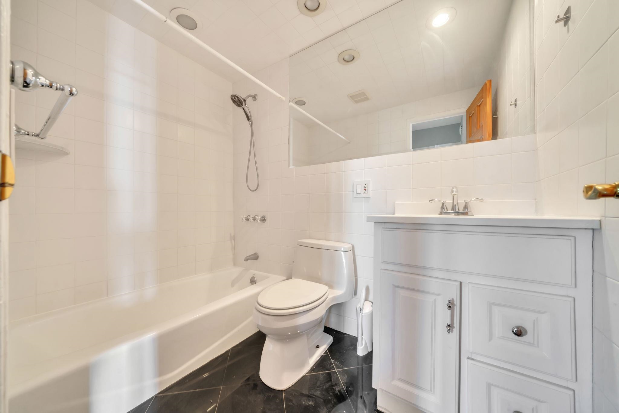 380 Mountain Road, Unit 213 Union City, NJ 07087 - Photo 27 of 36 a bathroom with a sink toilet and shower