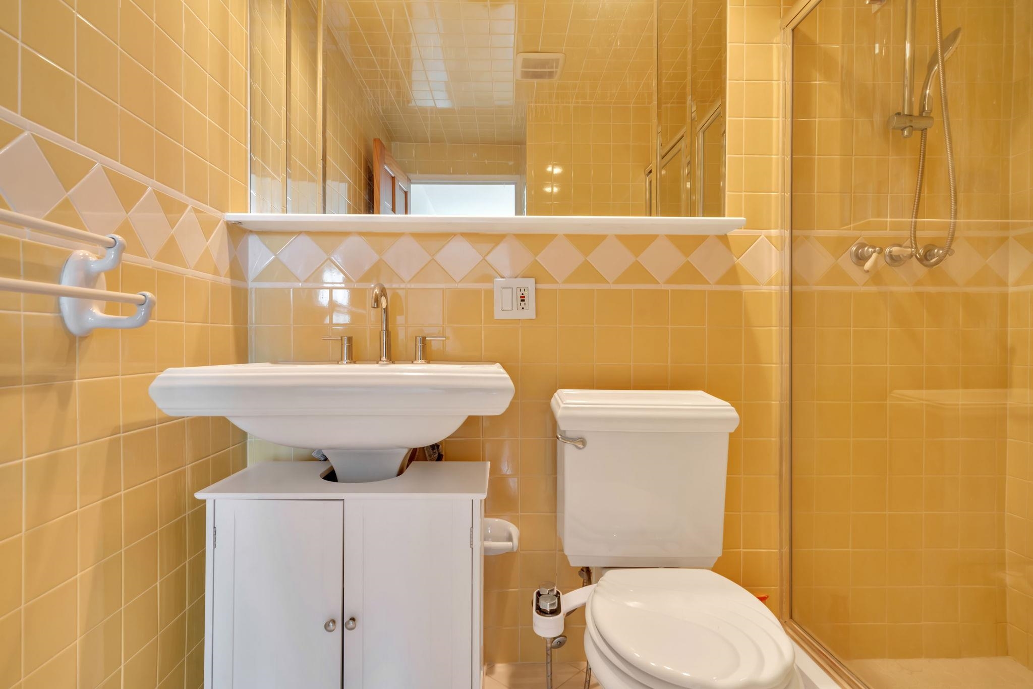 380 Mountain Road, Unit 213 Union City, NJ 07087 - Photo 29 of 36 a bathroom with a sink mirror toilet and next to a window