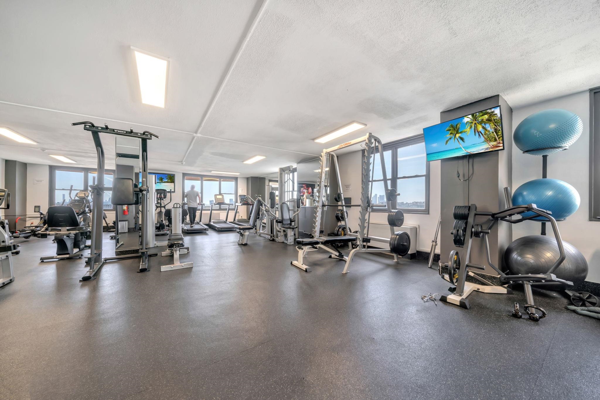380 Mountain Road, Unit 213 Union City, NJ 07087 - Photo 32 of 36 a view of a room with gym equipment