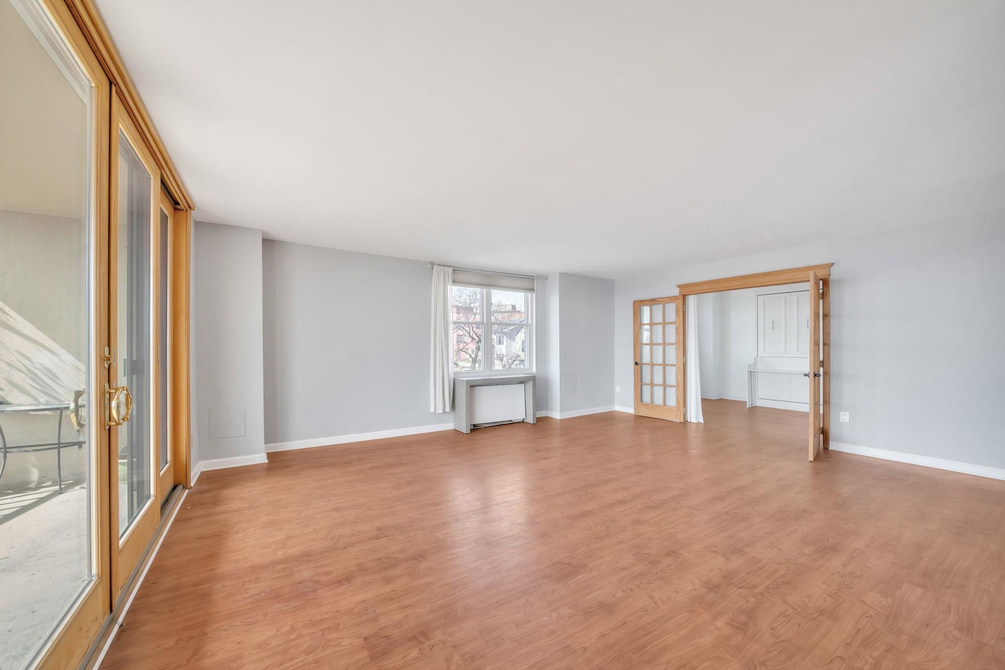 380 Mountain Road, Unit 213 Union City, NJ 07087 - Photo 5 of 36 a view of an empty room with a window