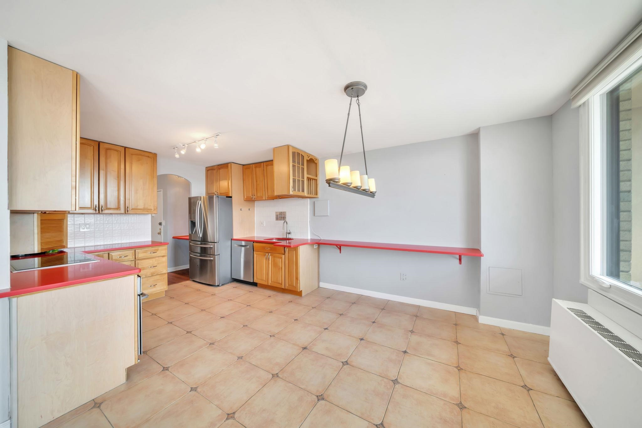 380 Mountain Road, Unit 213 Union City, NJ 07087 - Photo 9 of 36 a view of a kitchen with furniture and a window