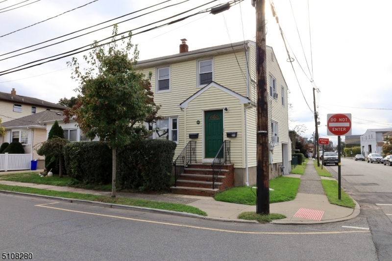159 Prospect Street, Unit 2 Garfield, NJ 07026 - Photo 1 of 13 a front view of a house with a yard