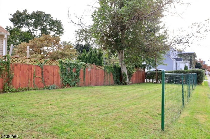 159 Prospect Street, Unit 2 Garfield, NJ 07026 - Photo 13 of 13 a view of a chairs and table on the wooden deck