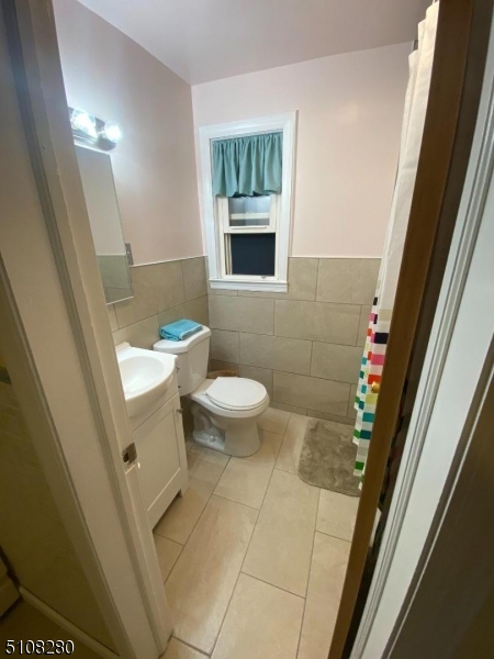 159 Prospect Street, Unit 2 Garfield, NJ 07026 - Photo 10 of 13 a bathroom with a toilet and a shower