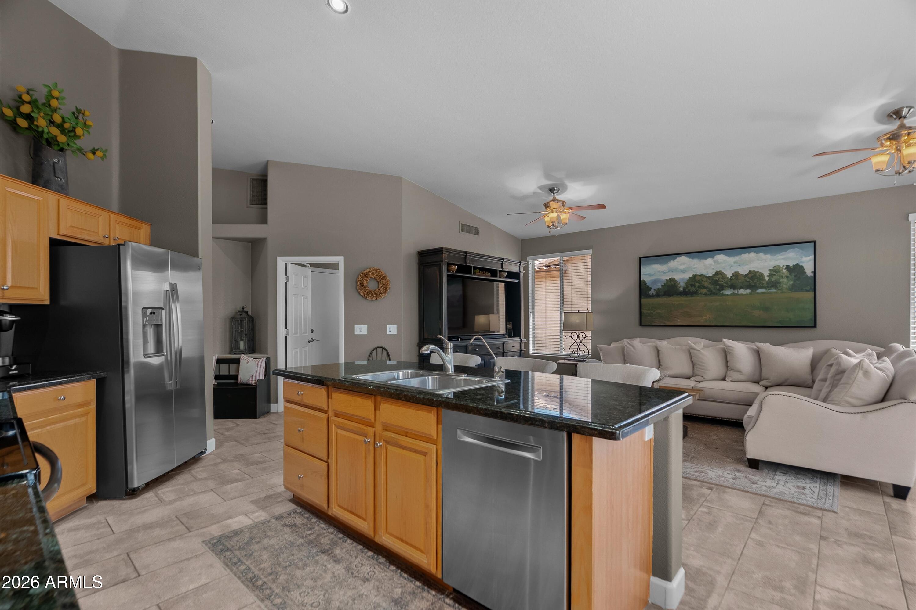4685 East Walnut Road Gilbert, AZ 85298 - Photo 12 of 58 a living room with furniture and a flat screen tv