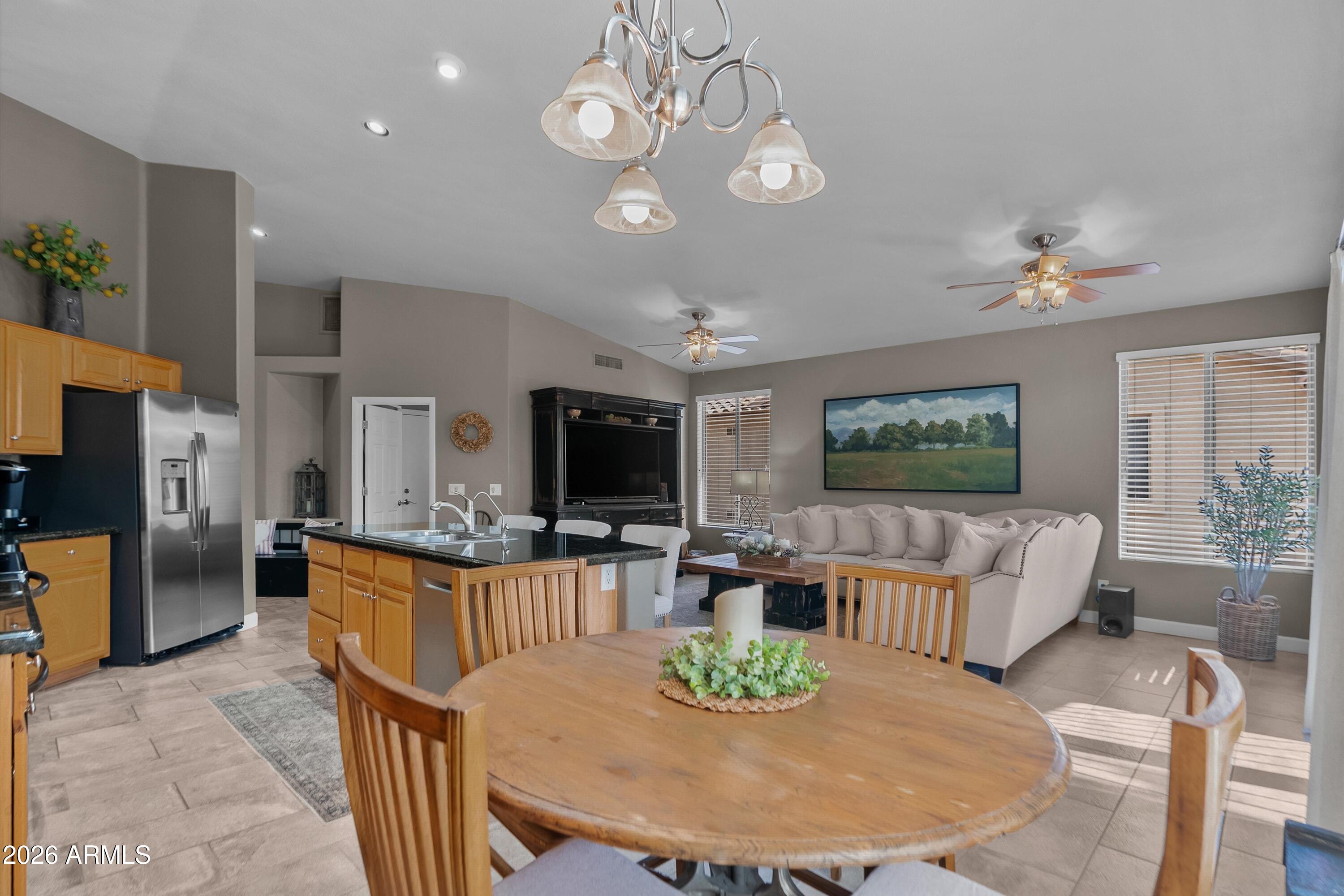 4685 East Walnut Road Gilbert, AZ 85298 - Photo 16 of 58 a living room with fireplace furniture and a flat screen tv