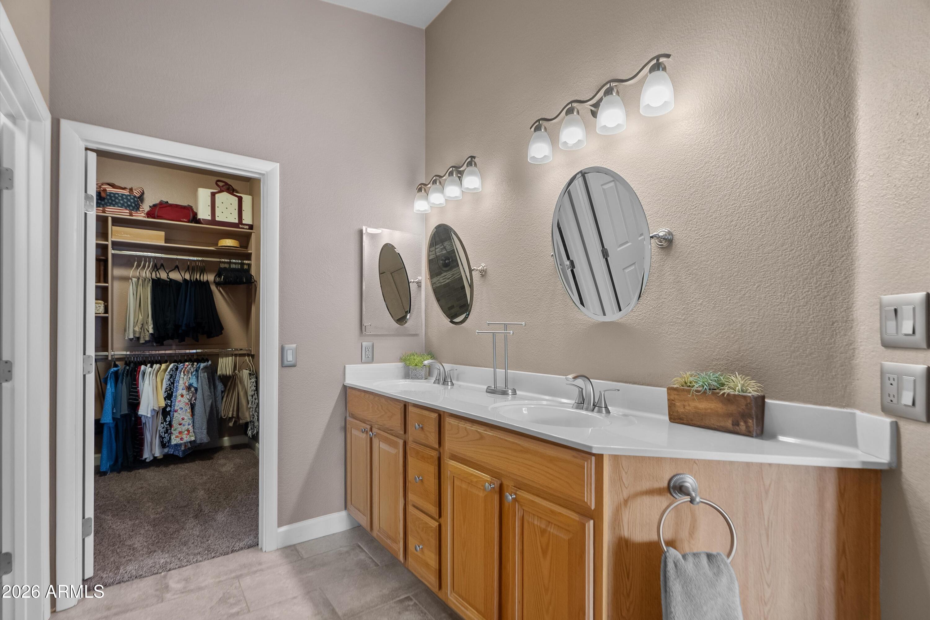 4685 East Walnut Road Gilbert, AZ 85298 - Photo 22 of 58 a bathroom with a double vanity sink and a mirror
