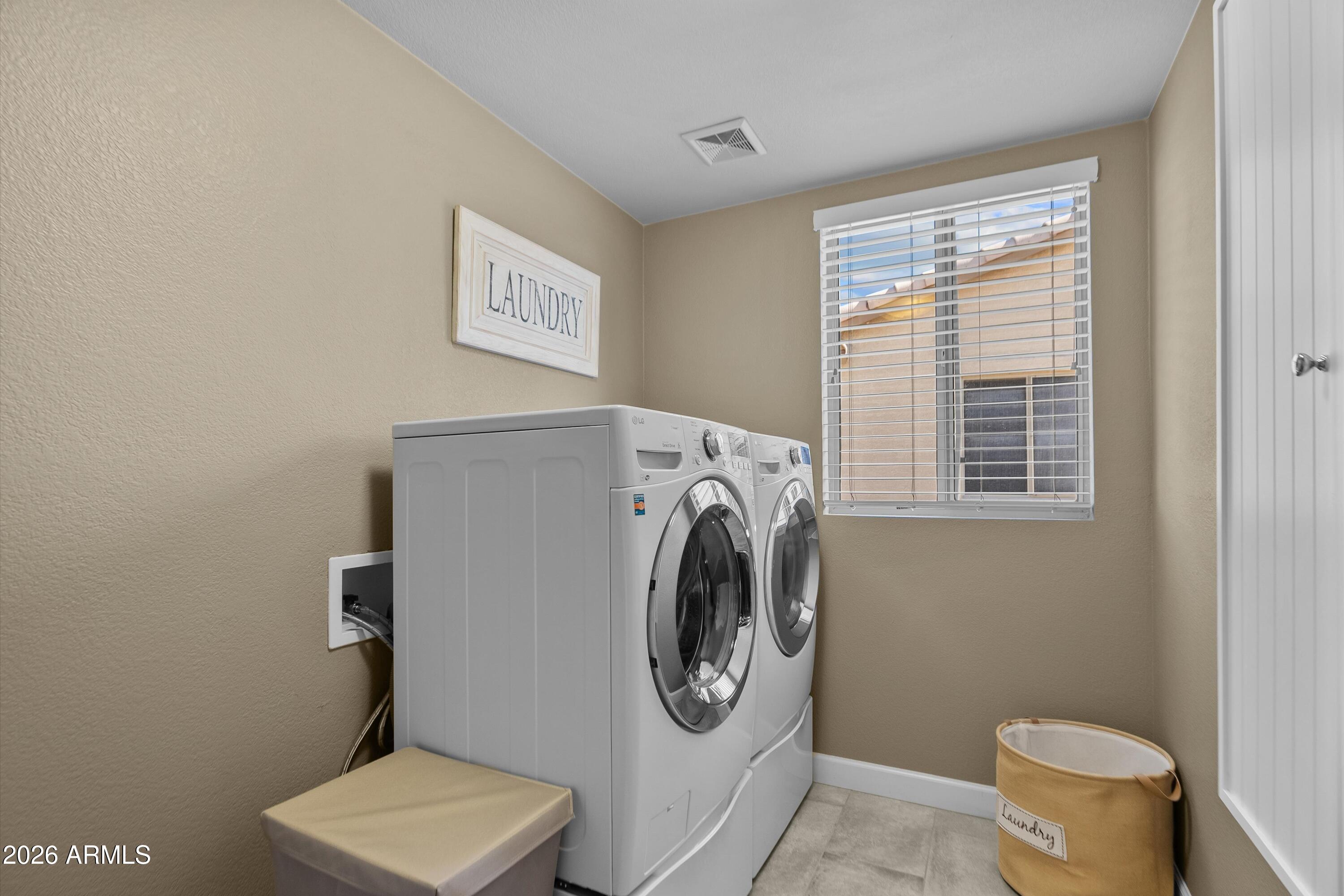 4685 East Walnut Road Gilbert, AZ 85298 - Photo 28 of 58 a utility room with dryer and washer