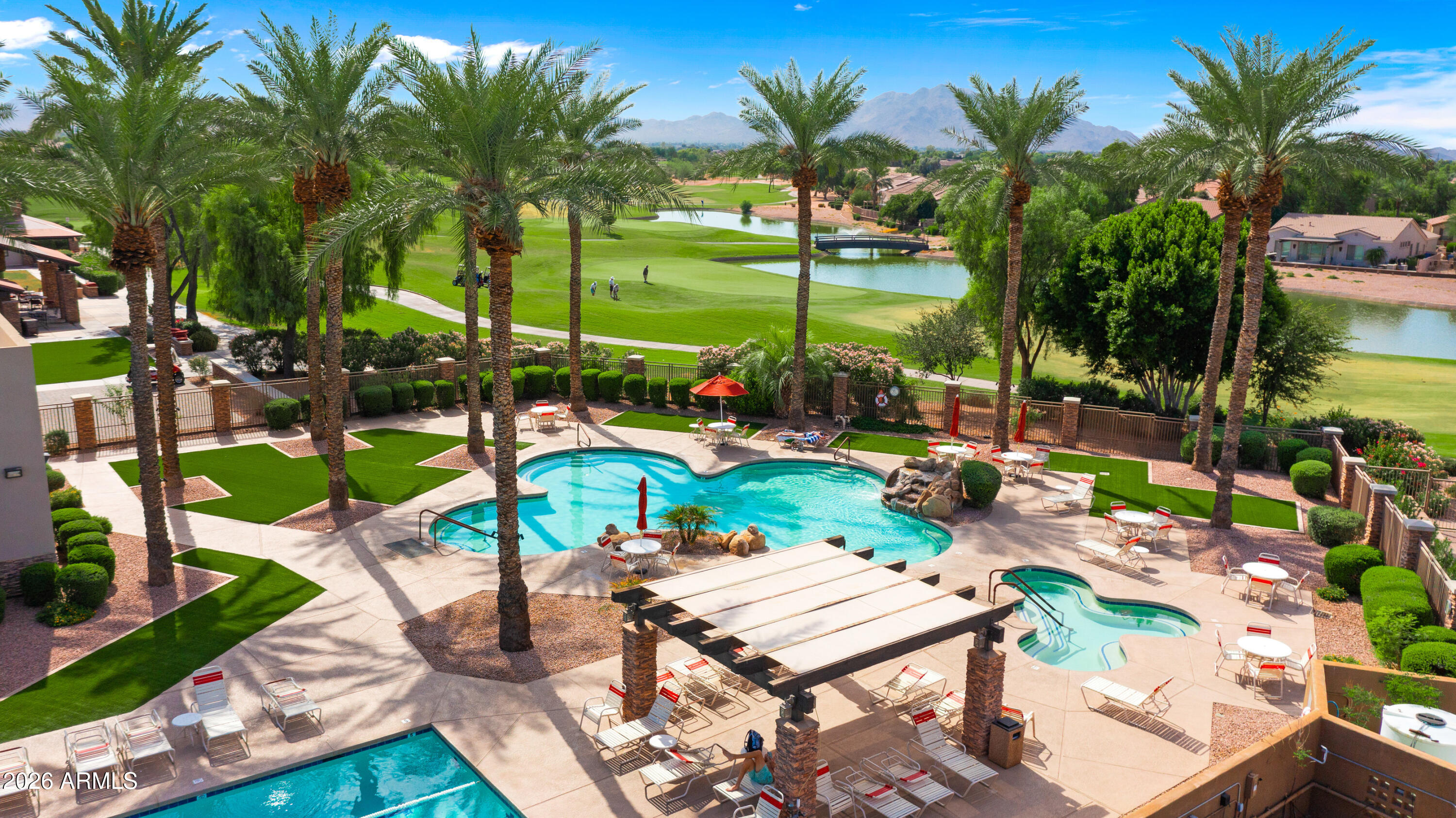 4685 East Walnut Road Gilbert, AZ 85298 - Photo 55 of 58 an outdoor space with seating area and swimming pool