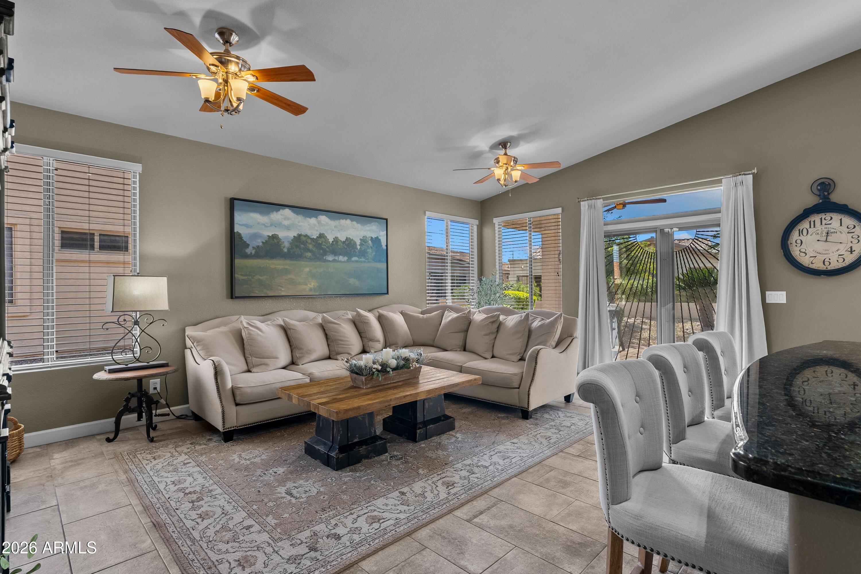 4685 East Walnut Road Gilbert, AZ 85298 - Photo 6 of 58 a living room with furniture a table and a large window