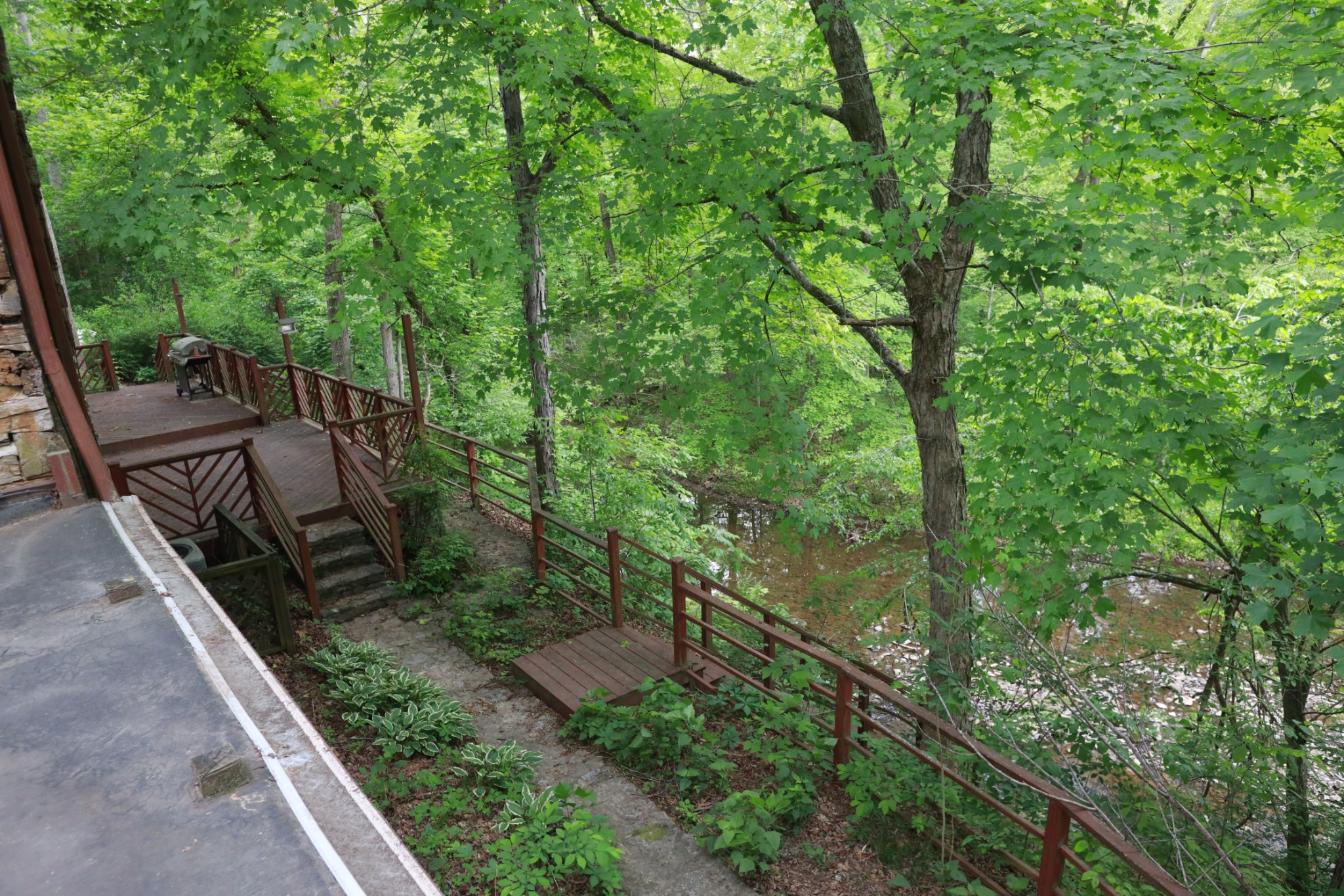 2634 Distillery Road Greenbrier, TN 37073 - Photo 2 of 35 a view of a yard with plants and wooden fence