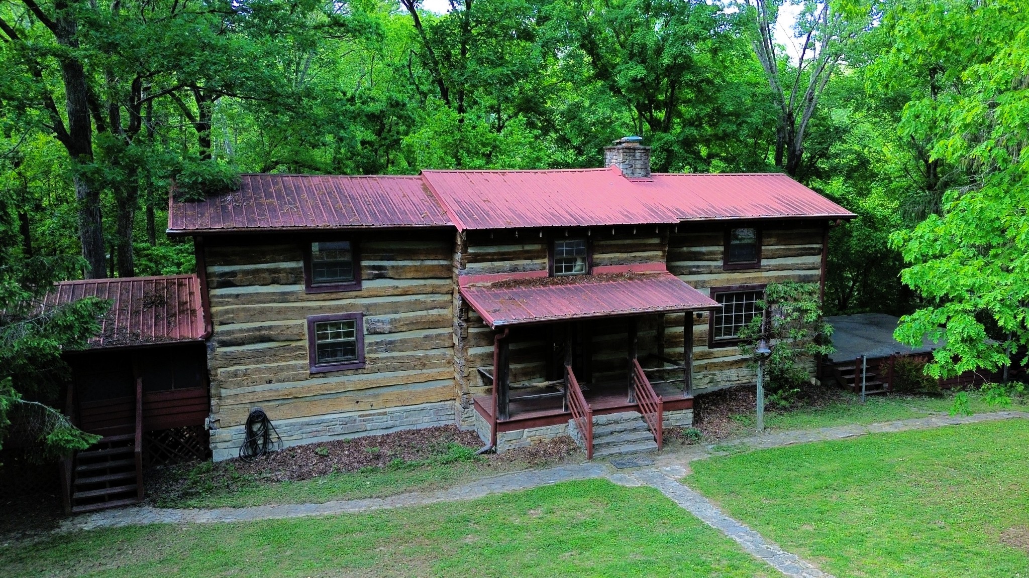 2634 Distillery Road Greenbrier, TN 37073 - Photo 3 of 35 a front view of a house with a garden and deck