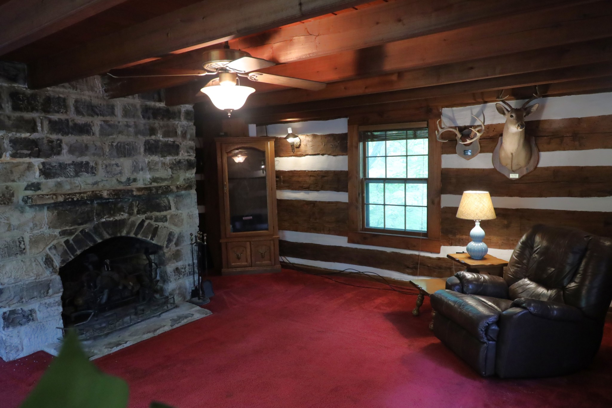 2634 Distillery Road Greenbrier, TN 37073 - Photo 10 of 35 a living room with furniture gym equipment and a fireplace
