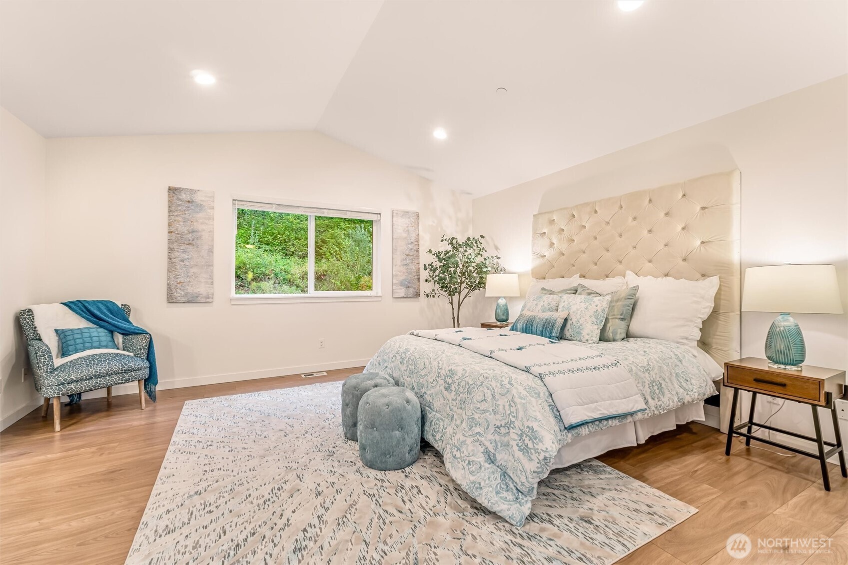 9213 Odin Way Bothell, WA 98011 - Photo 20 of 40 a bedroom with a bed and a chair