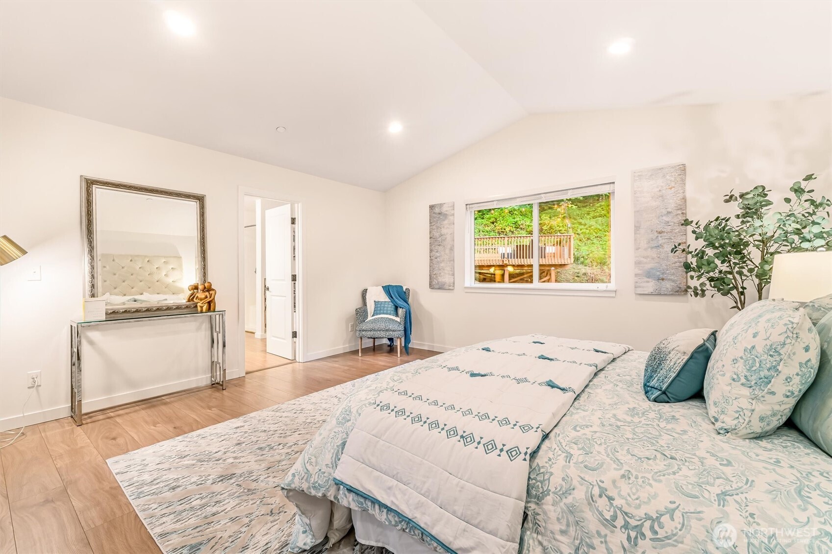 9213 Odin Way Bothell, WA 98011 - Photo 21 of 40 a bedroom with a large bed and a large window