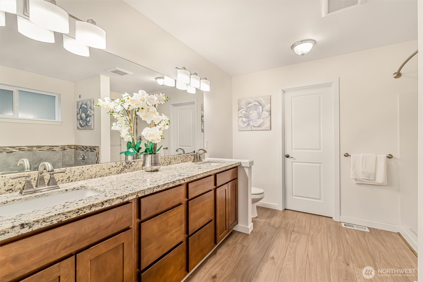 9213 Odin Way Bothell, WA 98011 - Photo 22 of 40 a bathroom with a granite countertop sink mirror and vanity