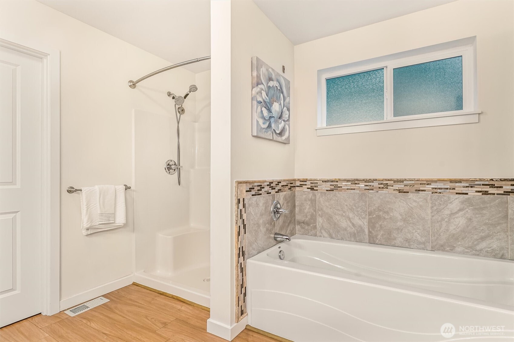 9213 Odin Way Bothell, WA 98011 - Photo 23 of 40 a bathroom with a bathtub and a shower