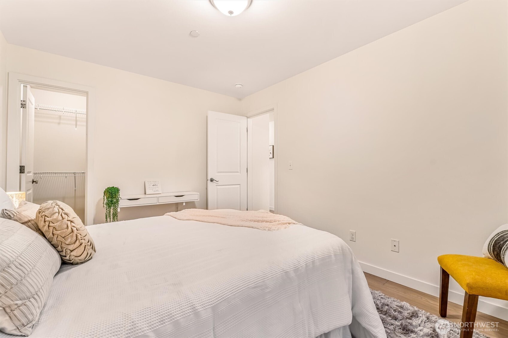 9213 Odin Way Bothell, WA 98011 - Photo 26 of 40 a bedroom with a bed and chair