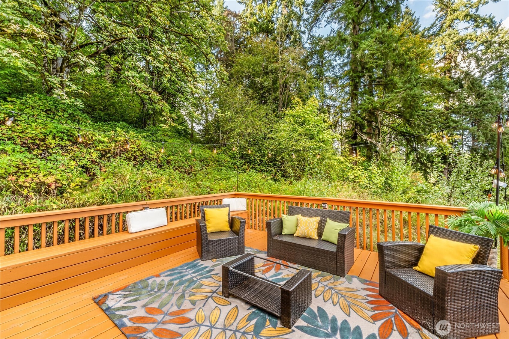 9213 Odin Way Bothell, WA 98011 - Photo 35 of 40 a view of a balcony with wooden floor and outdoor seating