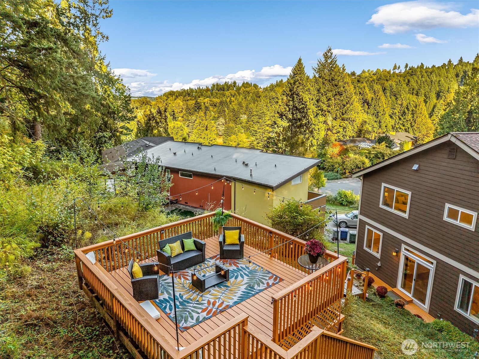 9213 Odin Way Bothell, WA 98011 - Photo 36 of 40 a view of a roof deck with couches and wooden floor