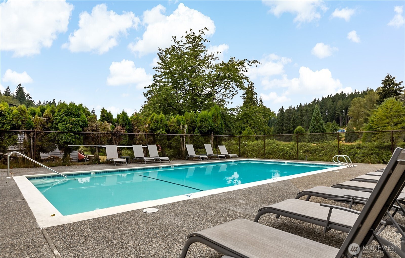 9213 Odin Way Bothell, WA 98011 - Photo 40 of 40 a view of a swimming pool with a yard