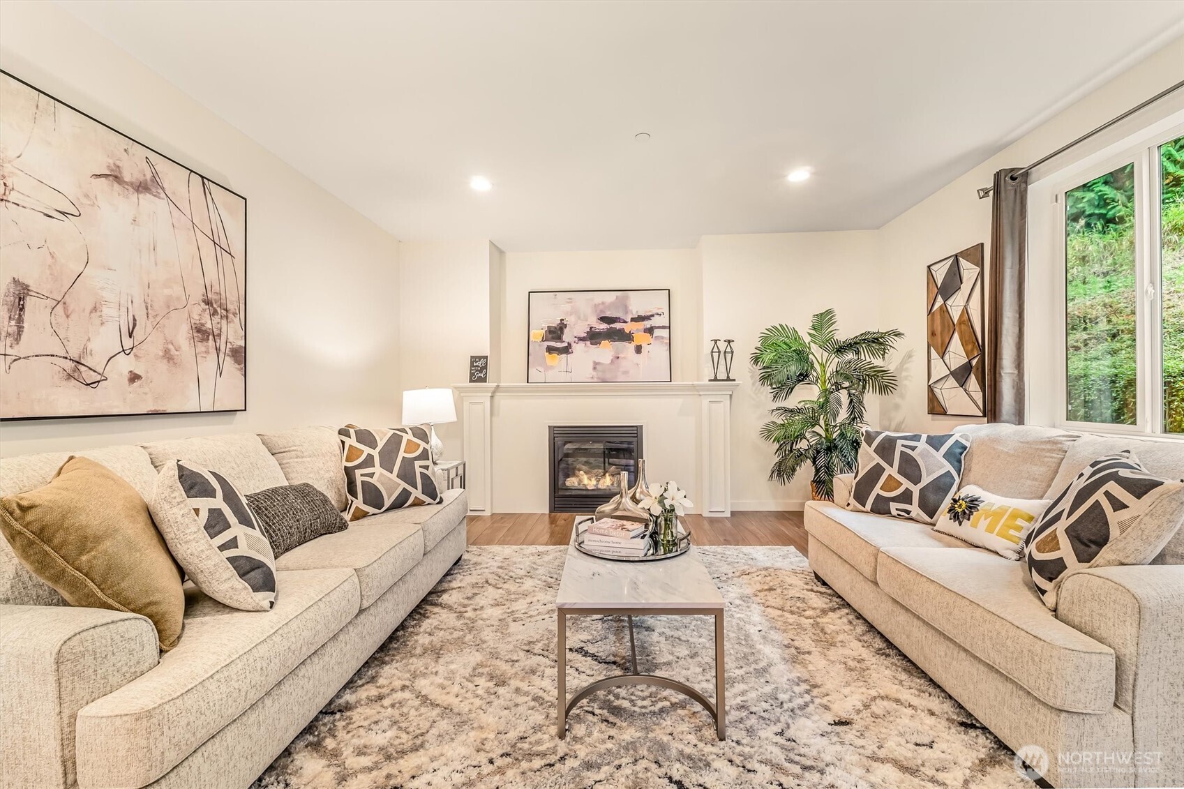 9213 Odin Way Bothell, WA 98011 - Photo 5 of 40 a living room with furniture and a fireplace