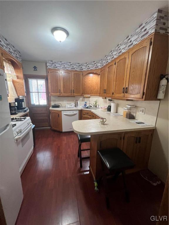 524 Greenleaf Street Allentown, PA 18102 - Photo 10 of 26 a kitchen with a sink a stove and chairs