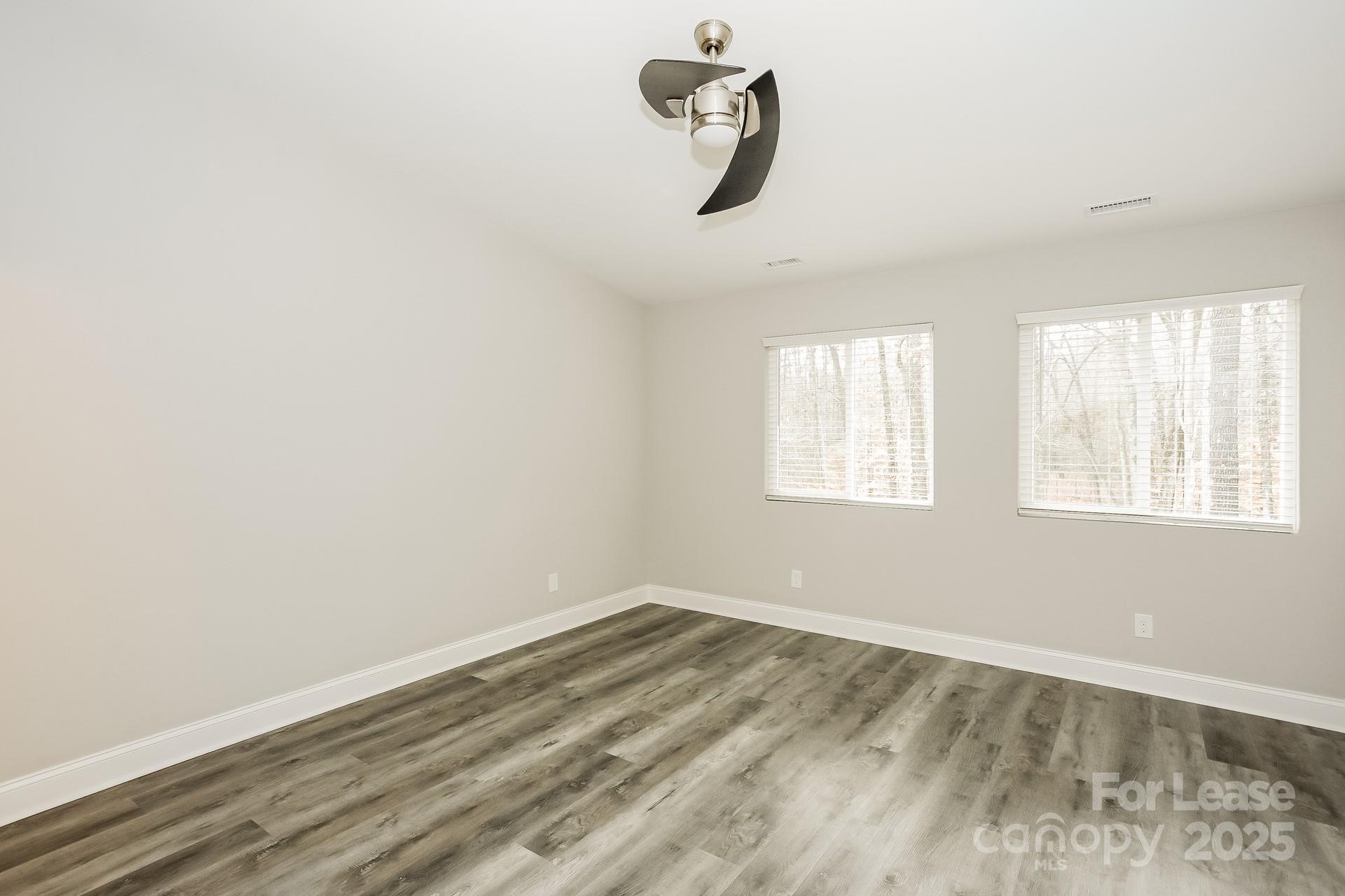 3987 Flat Rock Road Terrell, NC 28682 - Photo 11 of 17 an empty room with windows
