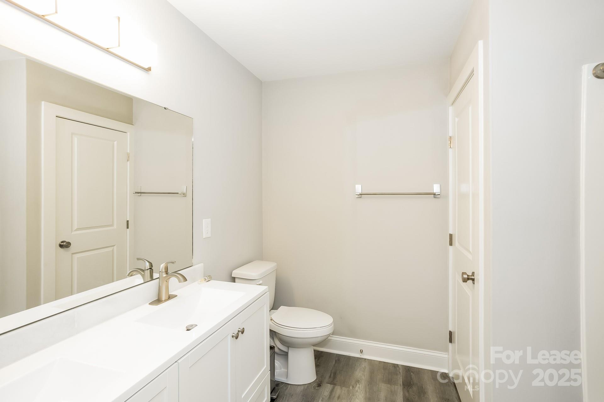 3987 Flat Rock Road Terrell, NC 28682 - Photo 12 of 17 a bathroom with a sink a toilet and shower