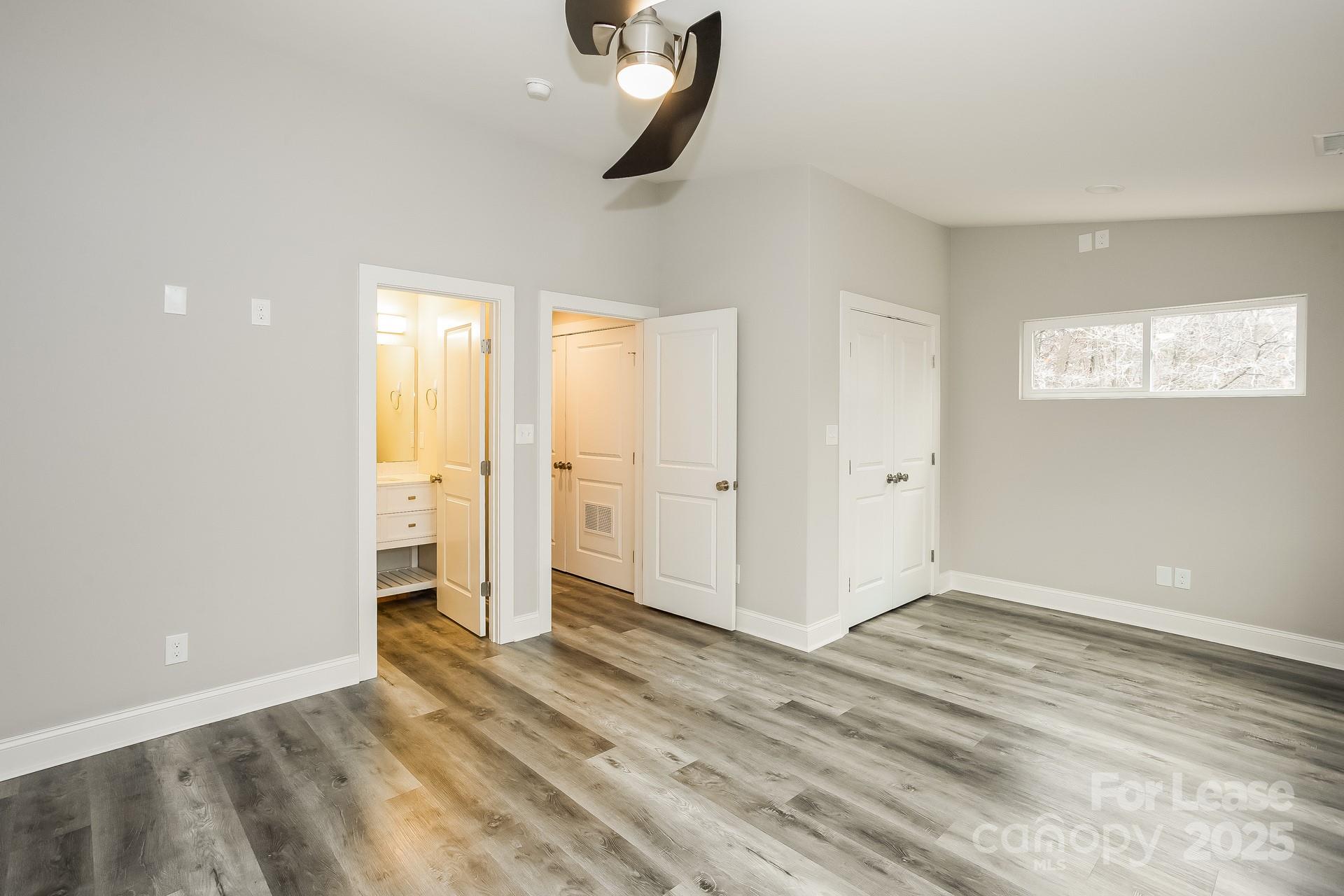 3987 Flat Rock Road Terrell, NC 28682 - Photo 15 of 17 wooden floor in an empty room with a window