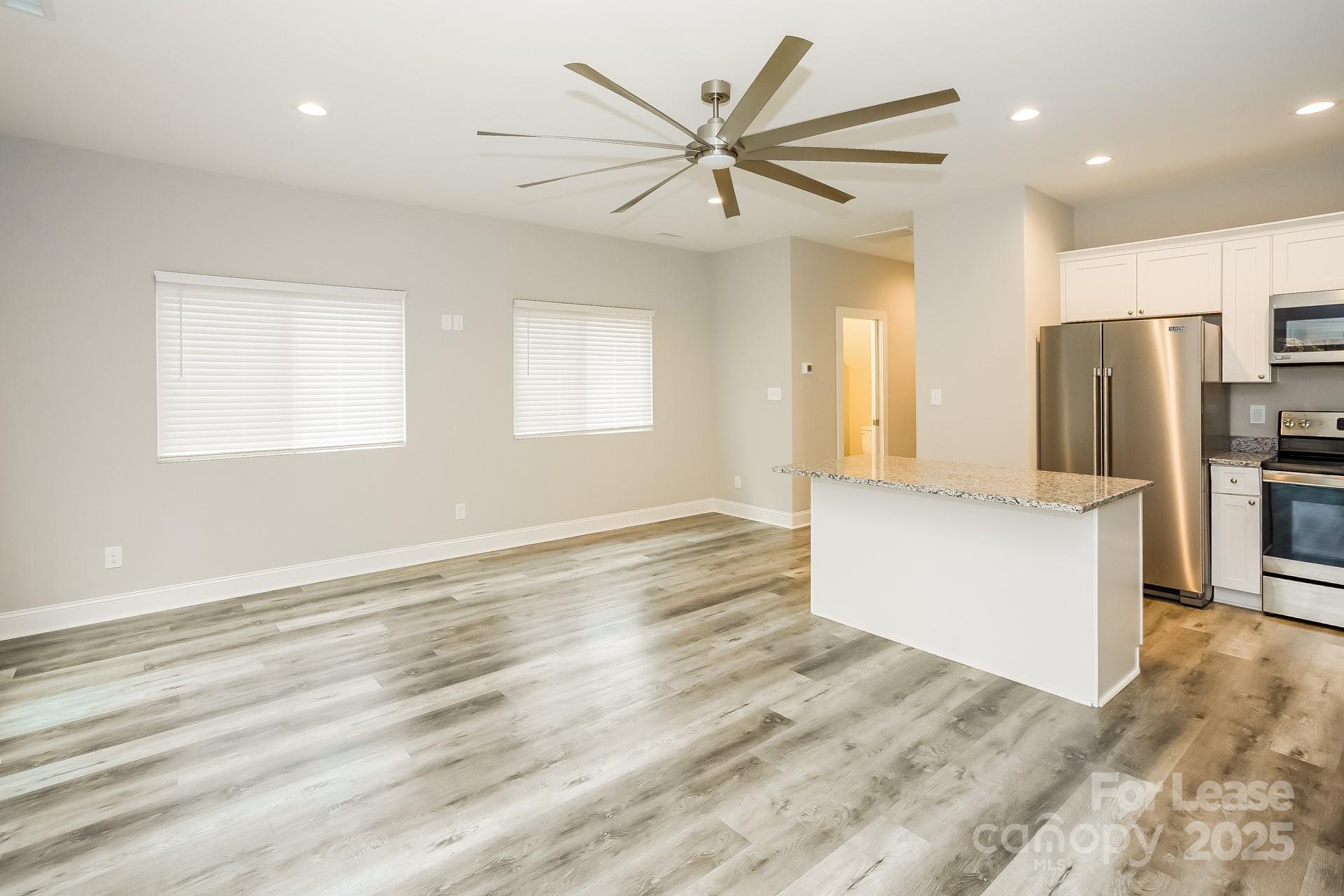 3987 Flat Rock Road Terrell, NC 28682 - Photo 7 of 17 a view of a kitchen with a sink and a refrigerator