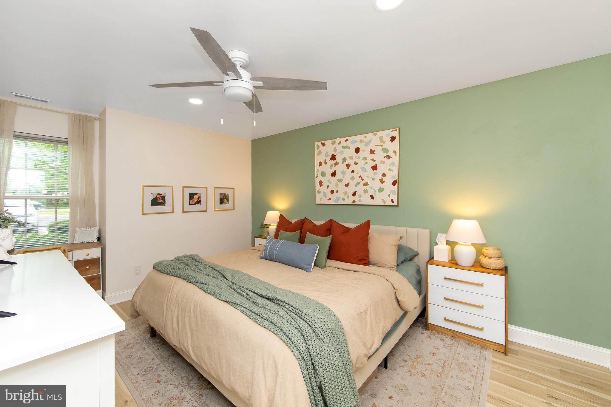 166 Tavistock Cherry Hill, NJ 08034 - Photo 16 of 38 a bedroom with a bed and a wall painting