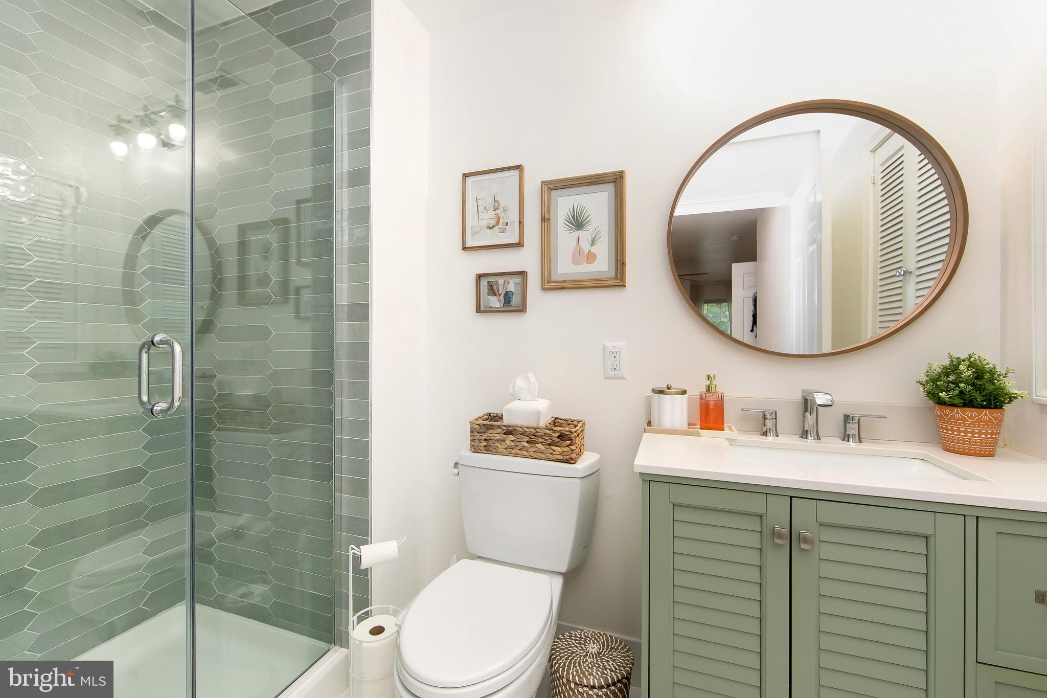 166 Tavistock Cherry Hill, NJ 08034 - Photo 18 of 38 a bathroom with a sink a toilet and a mirror