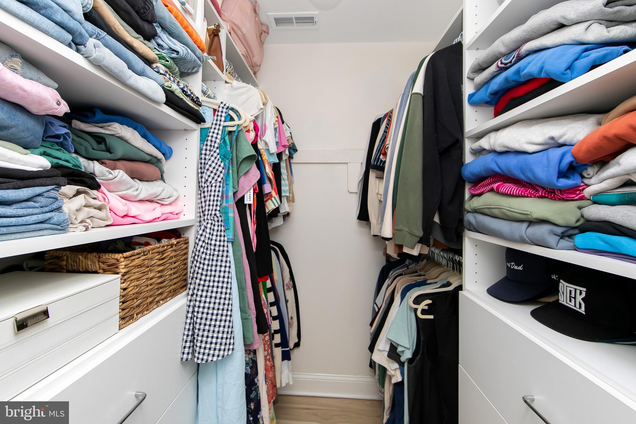 166 Tavistock Cherry Hill, NJ 08034 - Photo 20 of 38 a view of walk in closet with clothes and shoes