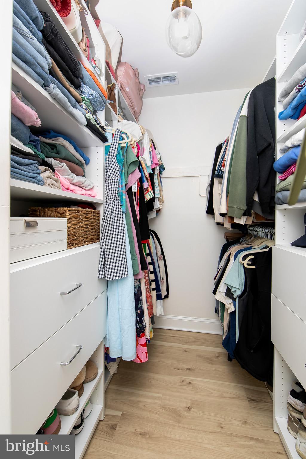 166 Tavistock Cherry Hill, NJ 08034 - Photo 21 of 38 a view of walk in closet with clothes and shoes