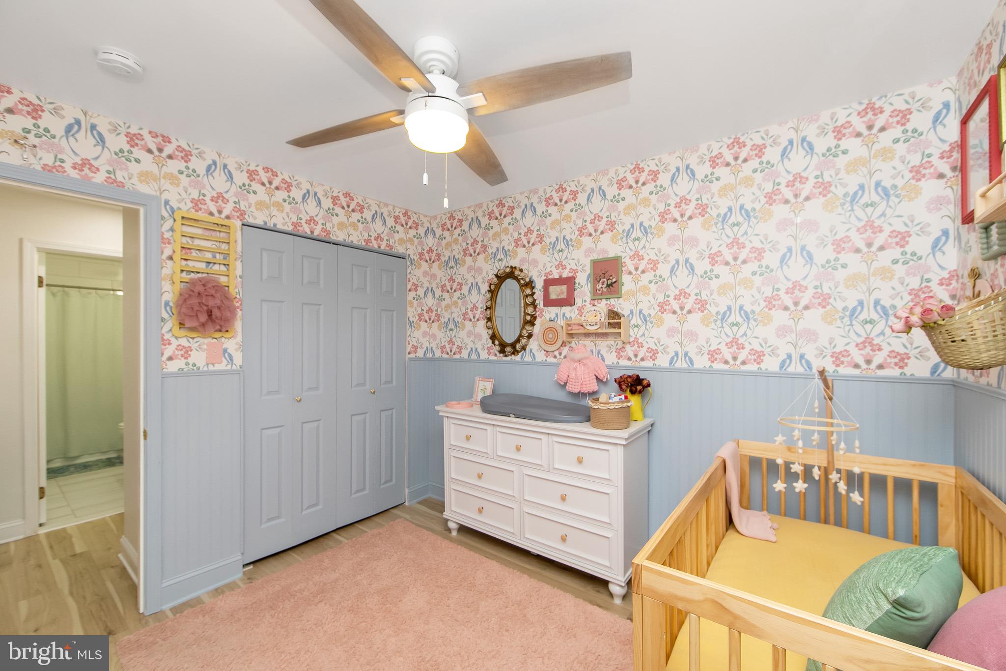 166 Tavistock Cherry Hill, NJ 08034 - Photo 24 of 38 a bedroom with a bed and wooden floor