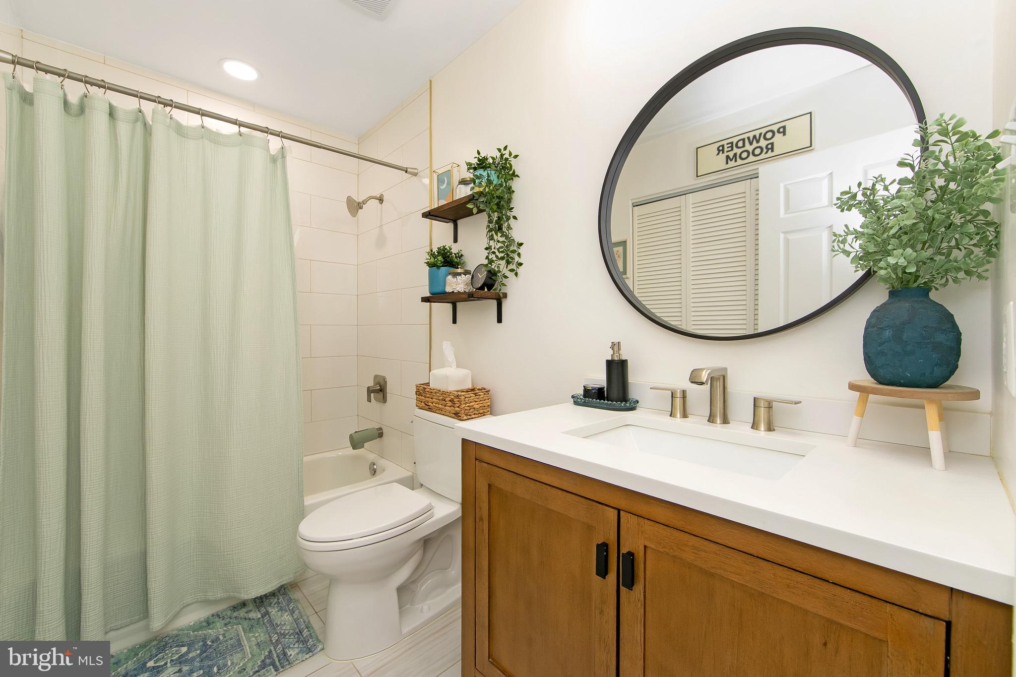166 Tavistock Cherry Hill, NJ 08034 - Photo 25 of 38 a bathroom with a toilet sink and mirror