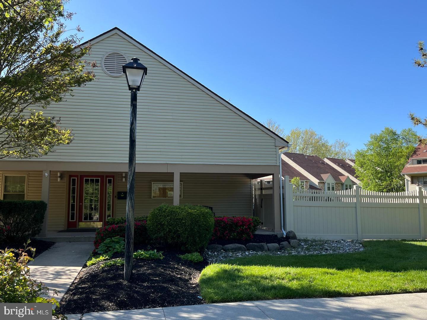 166 Tavistock Cherry Hill, NJ 08034 - Photo 32 of 38 a front view of a house with a garden and plants