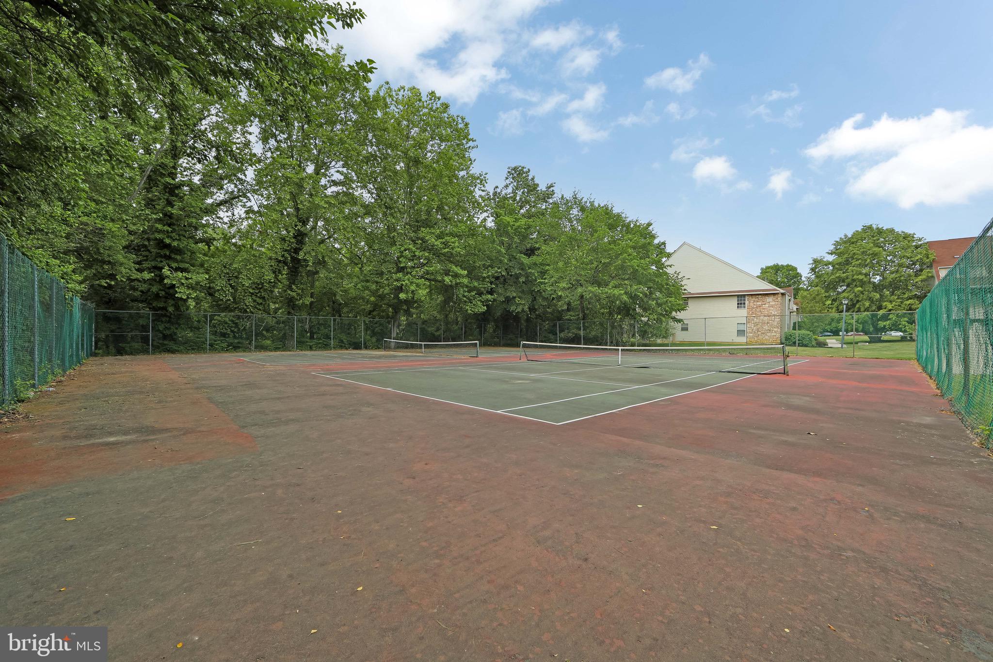 166 Tavistock Cherry Hill, NJ 08034 - Photo 36 of 38 a view of a field with a trees in the background