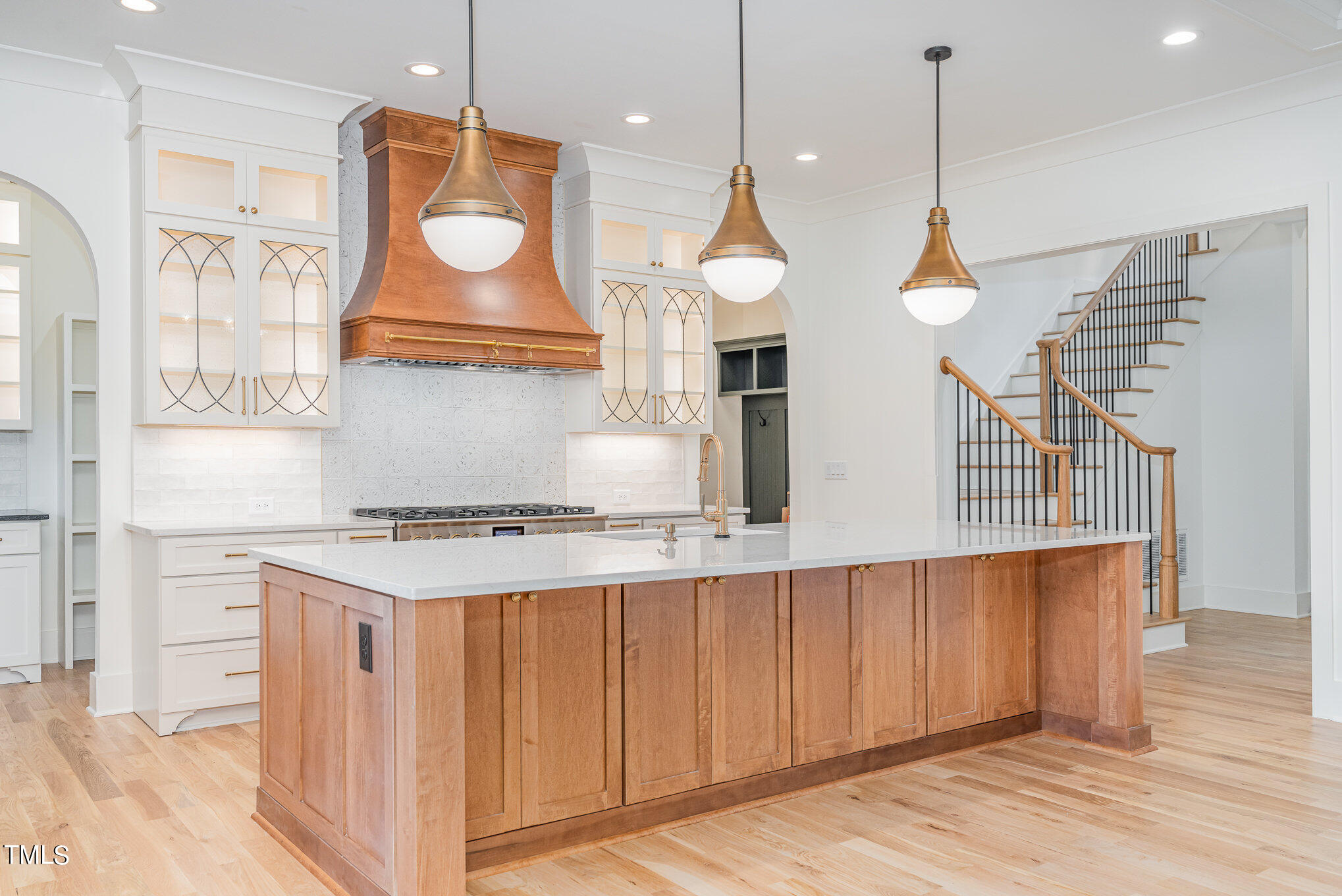 222 Kenwood Lane Pittsboro, NC 27312 - Photo 10 of 24 a kitchen with stainless steel appliances granite countertop a stove a sink and a wooden floors