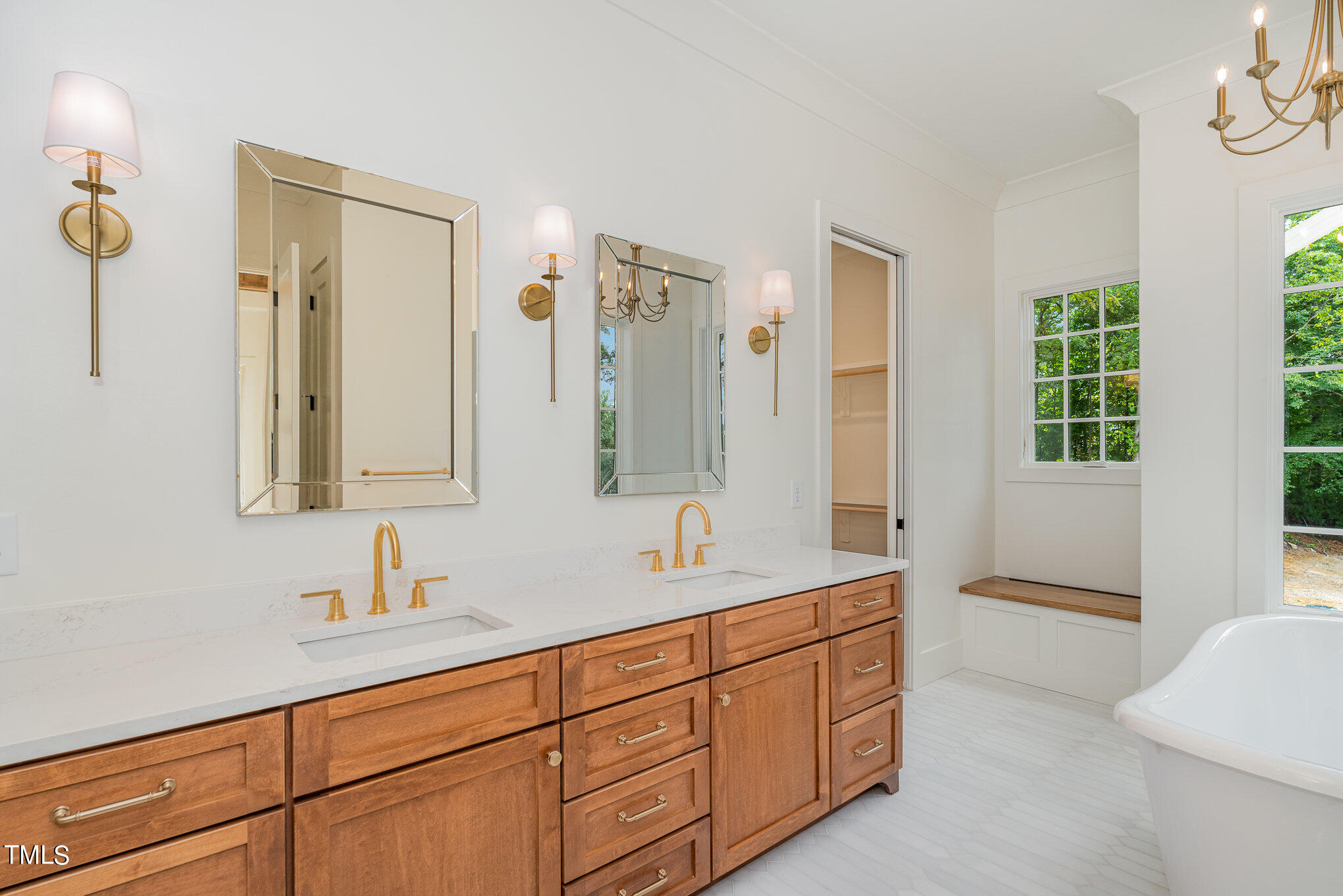222 Kenwood Lane Pittsboro, NC 27312 - Photo 15 of 24 a spacious bathroom with double vanity sinks a mirror and a bathtub