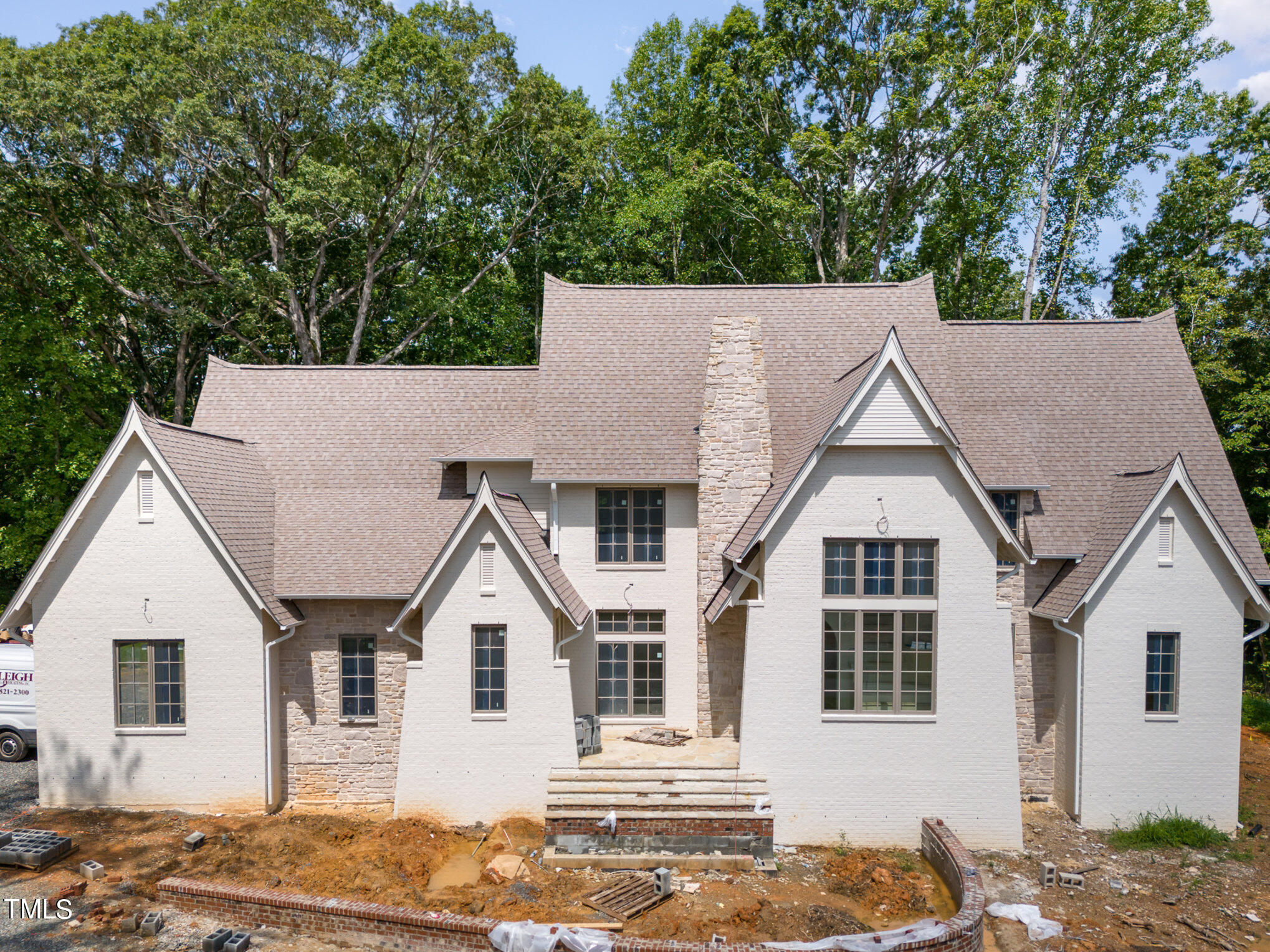 222 Kenwood Lane Pittsboro, NC 27312 - Photo 19 of 24 a view of a white house next to a yard