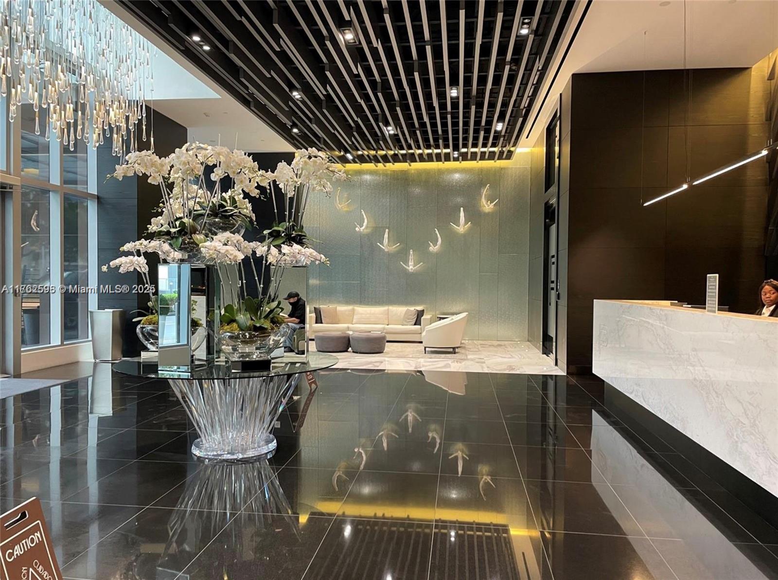 851 Northeast 1st Avenue, Unit 904 Miami, FL 33132 - Photo 11 of 14 a view of a living room and dining room