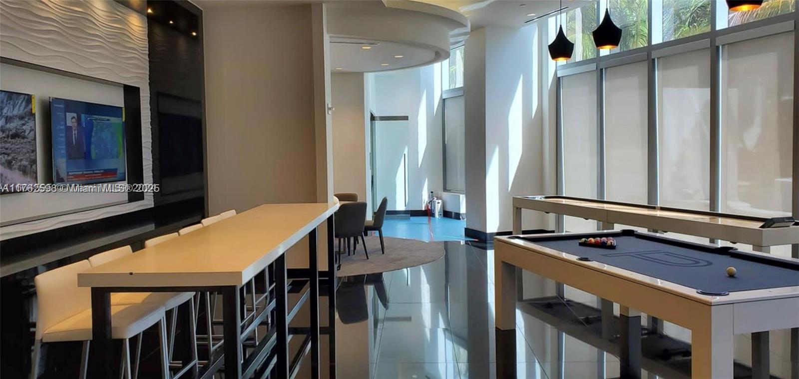 851 Northeast 1st Avenue, Unit 904 Miami, FL 33132 - Photo 13 of 14 a bathroom with a sink and a mirror