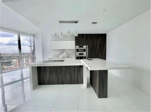 a bed room with a bed and a view of bedroom